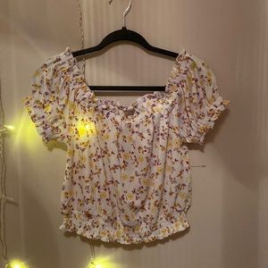 White semi cropped blouse. Flower printer. Scrunched @ shoulders and waist.